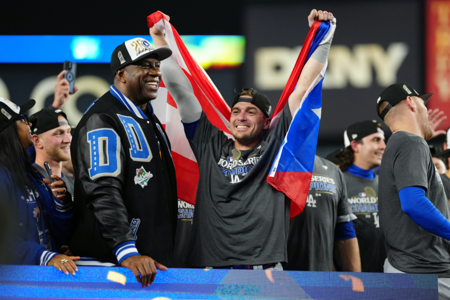 Gay favorite & LGBTQ+ ally Kiké Hernández wears the Puerto Rico flag in World Series celebration