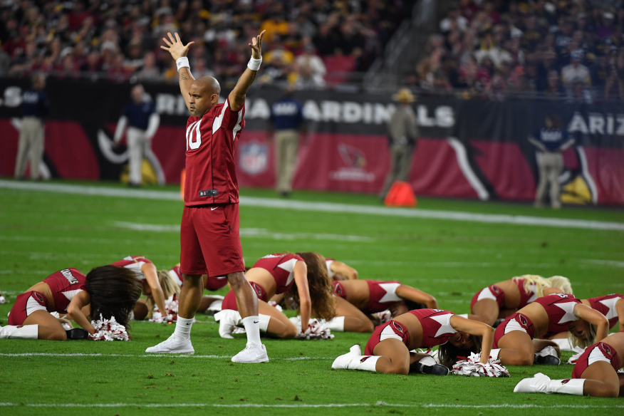 Fitness icon Shaun T cheers the Arizona Cardinals to victory in their season finale